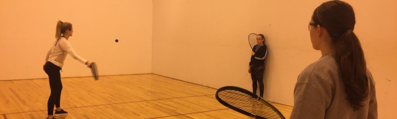 People playing racquetball